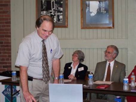Bob Driggers presents Power Point as Peggy Maruthur and Gene Shelby look on